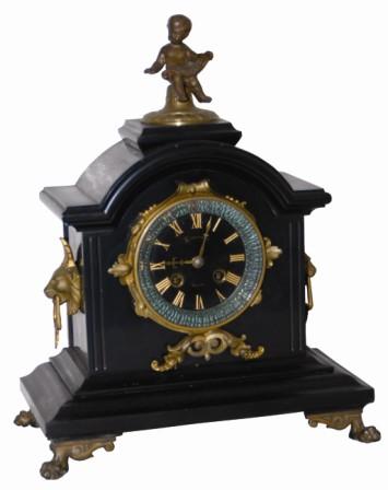 French black marble clock with metal ornamentation, from feet underneath to the small cupid on the top. No ornamental pieces are missing. — Antique Clocks Price Guide