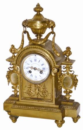 French brass shelf clock, overall in very good original condition. It is 15" tall, has several cast objects and moldings cast into the feet and case body. — Antique Clocks Price Guide
