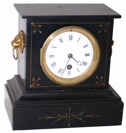 French marble clock, small and cheap. Incised designs on the front, gold filled, case is complete and has no breaks or repairs, only the usual microscopic edge nicks. — Antique Clocks Price Guide