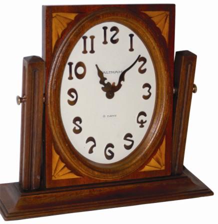 Waltham swing frame dresser/desk clock. The wood case is 12" wide, 10" high, some inlay around the dial frame, and overall in very nice clean, complete, condition. — Antique Clocks Price Guide