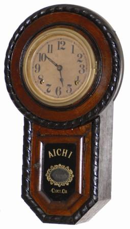 Japanese short drop clock, very ornately decorated with rope carved moldings around the front edges. The case is 18.5" high, probably made with an evergreen type wood, probably pine, stained dark. — Antique Clocks Price Guide