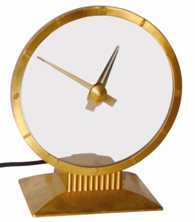 Jefferson Golden Hour Clock, ca 1949. The metal case is 9" tall and finished in gold. — Antique Clocks Price Guide
