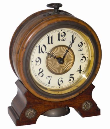 German alarm clock in a wood case. Brass ornaments top and base, flat glass in the sash, very good dial and hands, bell underneath. — Antique Clocks Price Guide