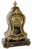 French mantle clock, wood case with bronze cast ornaments and inlaid brass all around except for the back. Matching base with the same type inlaid brass all around.