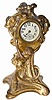American novelty clock, art nouveau style case featuring a young woman coming into the world via a flower.