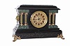 Seth Thomas Clock Co. adamantine finished case is black with green marbleized moldings around each end and the top layer of adamantine is green.