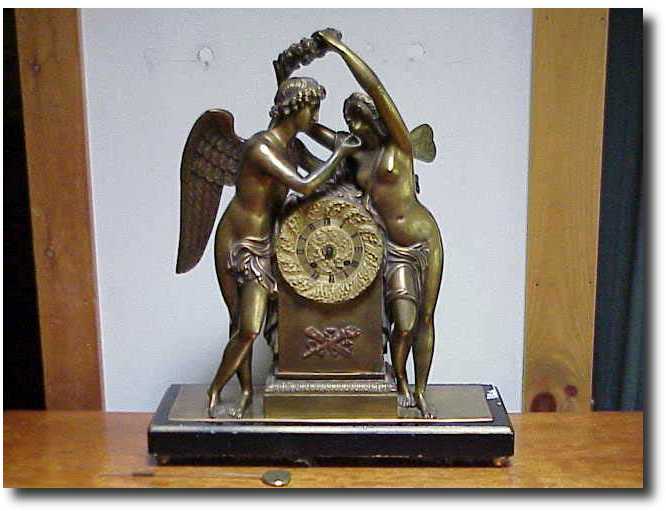 French brass Double figural mantel clock — Antique Clocks Price Guide