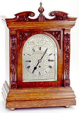 CARVED OAK BRACKET CLOCK, English, c.1900; — Antique Clocks Price Guide