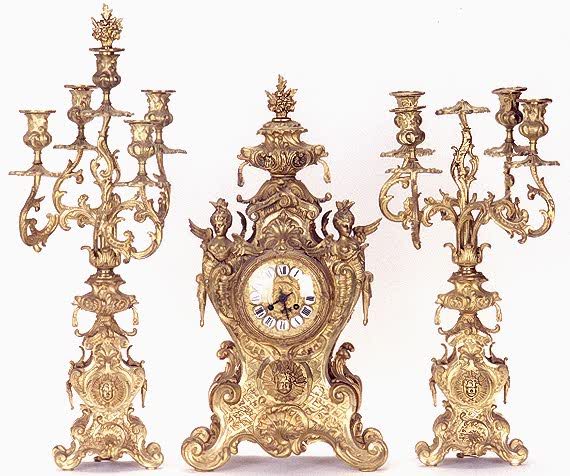 A FRENCH GILT BRONZE THREE PIECE CLOCK SET. — Antique Clocks Price Guide