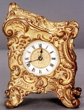 FRENCH GILT METAL DESK CLOCK. — Antique Clocks Price Guide