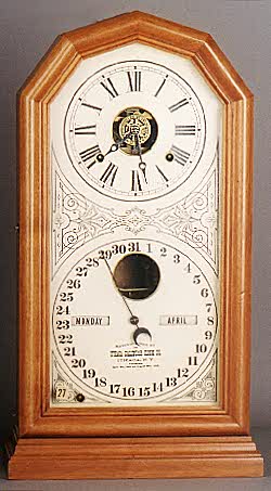 ITHACA CALENDAR SHELF CLOCK, Model No. 11, octagon "Poni", eight day time and strike movement with alarm, — Antique Clocks Price Guide