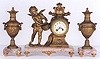 A FRENCH THREE PIECE GILT BRONZE CLOCK SET: