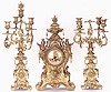 A FRENCH GILT BRONZE THREE PIECE CLOCK SET.