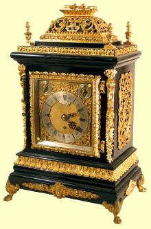 Very fine three train, basket top — Antique Clocks Price Guide