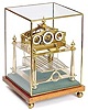 Elegant small Congreve clock - 9 1/2" high x 7 1/2" x 7 1/2".
