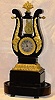 French lyre shaped mantel clock with top pendulum. circa 1860