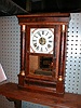 Eight-day miniature cornice and column clock.