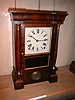 Miniature cornice and column 8-day clock by Seth Thomas Clock Company.