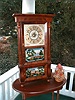 Column and cornice triple decker shelf clock.