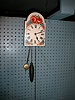 30-hour, pine cone weight powered wall clock.