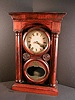 E. Ingraham  ARCH COLUMN No. 1  miniature cornice and column mantle clock with reverse painted door glass.