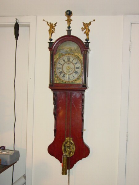 Friesian wall clock with painted dial and figures on bonnet. — Antique Clocks Price Guide