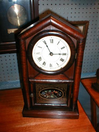 Peaked roof shelf clock by the New Haven Clock Company, New Haven, Connecticut. — Antique Clocks Price Guide