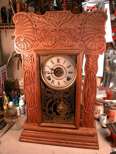 Oak, eight-day 'kitchen clock' with fancy wood and door glass. — Antique Clocks Price Guide