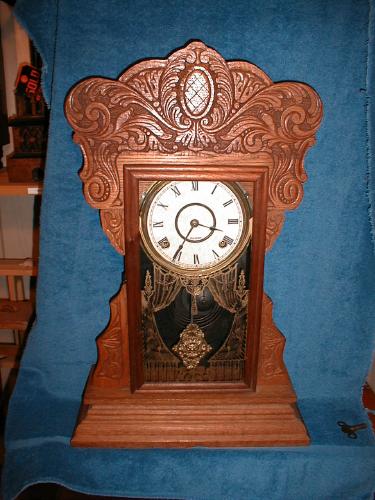 Oak "Gingerbread" mantel clock-8 day with strike on the hours and half/hour. — Antique Clocks Price Guide