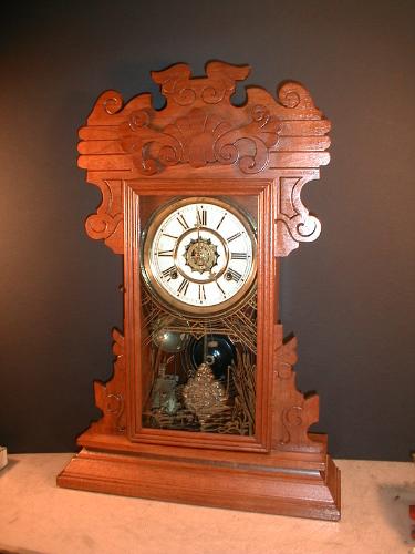 'THE NEWBURGH' Walnut Fancy mantle clock with alarm system. — Antique Clocks Price Guide