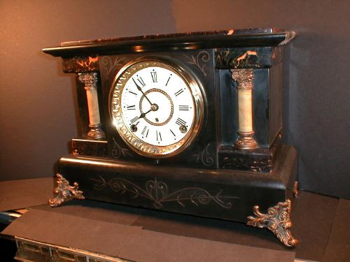 Enameled Black mantle clock with hourly strike. — Antique Clocks Price Guide