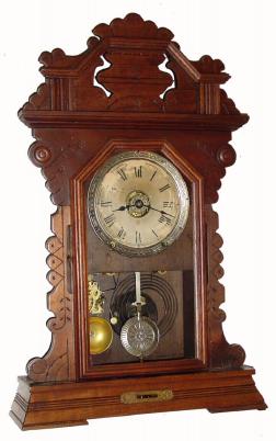 C.1890, Seth Thomas, Walnut Gingerbread clock with leveling spirit, 8-day time and strike with alarm. — Antique Clocks Price Guide