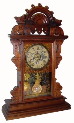 C.1890, Seth Thomas ÓBALL TOPÒ Eclipse style walnut gingerbread, 8-day, time, strike and alarm. — Antique Clocks Price Guide