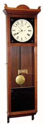 Mixed lot: A New Haven 30 double spring, 30 day movement, now in a meter pendulum walnut case. — Antique Clocks Price Guide