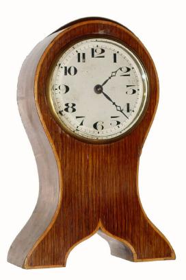 C.1930, Swiss, Oak Cased Desk timepiece, with a good 8-day platform lever escapement movement, and satinwood inlay along the edge of the clock. — Antique Clocks Price Guide
