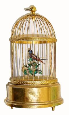 C.1950, Swiss, Reuge, Singing Bird in Cage. Bird decorated with real feathers, and animated during whistle sequence. — Antique Clocks Price Guide