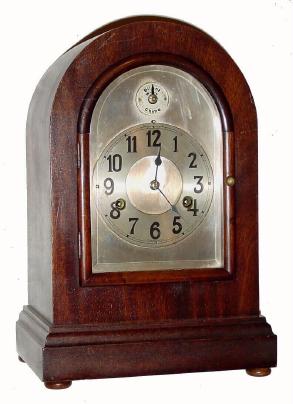 C.1905, German, 3/4 Westminster Chime mantel clock in a round top mahogany case. — Antique Clocks Price Guide