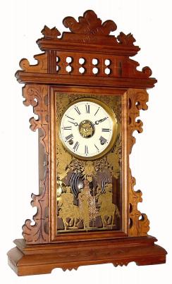 C.1885, E. N. Welch, ÒWalnut GingerbreadÓ with a glass of Conquistadors and a re-papered dial. — Antique Clocks Price Guide