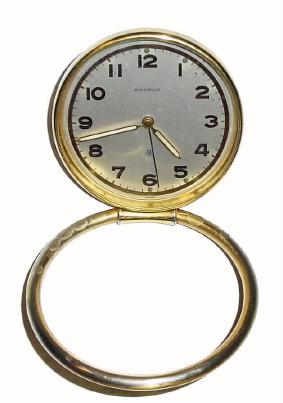 C.1960, Benrus, Swiss 8-day travel alarm, brass cased with a hoop that acts as either a base to set the clock or a ring to hang the clock.. — Antique Clocks Price Guide
