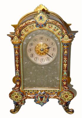 C.1890, French, Ormolu and Enamel desk clock with silvered floral mask and profuse decorations on the side of the case. — Antique Clocks Price Guide