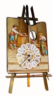 C.1900, French, ÓClock on EaselÒ, 8-day pendulette timepiece. The artists palette has the dial for the clock and also depicts a young man and woman in colorful attire. A brush and steady rest protrude from the thumb hole. The easel itself is made of brass. — Antique Clocks Price Guide