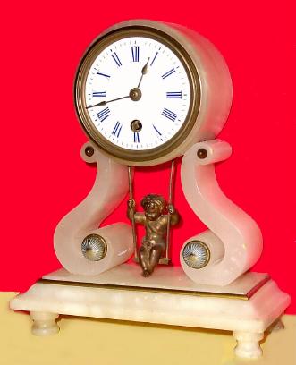 C.1890, French, ÓSwinging DollÒ, mantel clock, white alabaster case with ormolu waist trim and embossed button accents. — Antique Clocks Price Guide
