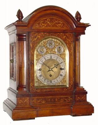 C.1895, German, Winterhalder and Hofmeier, 3-chain fusee, 9-gong quarter chime bracket clock, inlaid walnut case with arch dial and subsidiary dials for F/S, Chime/Silent, and tune selection (Whttington 8 gong, or Westminster 4 gong), striking the hours on a 9th deep toned cathedral gong. — Antique Clocks Price Guide