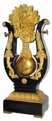 C.1840, French, Lyre Form Pendule, the pinwheel movement contained within the ÒbobÓ of the pendulum, which emulates the appearance of a globe. — Antique Clocks Price Guide