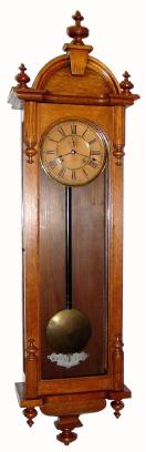 C.1900, Ansonia Clock Co., ÓCAPITALÒ, oak cased, double spring, time only wall clock. — Antique Clocks Price Guide