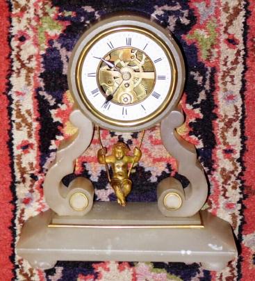 C.1890, French, Swinging Doll Timepiece, in a white alabaster case with brass trim, 8-day. — Antique Clocks Price Guide