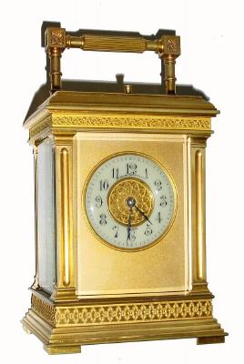 C.1900, French, Brass Cased Carriage clock, 8-day, time, strike and repeat, in a stylized case with square columns, and embossed bands across the top and bottom of the case, plus the dial center, the whole with original gilding. — Antique Clocks Price Guide
