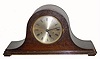 C.1920, English, ÒTambourÓ, or Napoleon hat clock, dark oak case, 8-day, gong strike. 