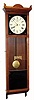 Mixed lot: A New Haven 30 double spring, 30 day movement, now in a meter pendulum walnut case. 
