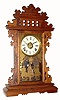 C.1885, E. N. Welch, ÒWalnut GingerbreadÓ with a glass of Conquistadors and a re-papered dial. 